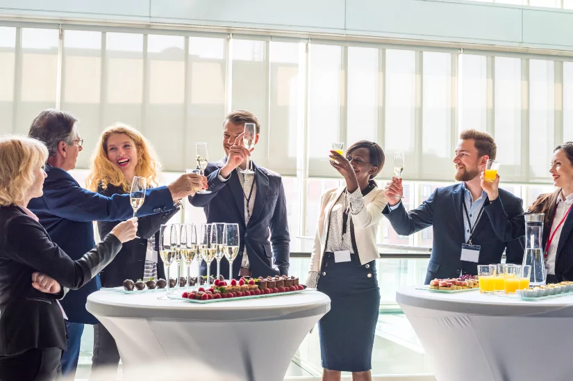 Office workers raising a toast on a company away day 