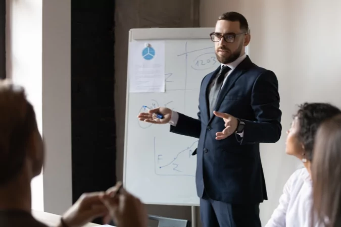 A businessman leading a training session to show that most training doesn't work.